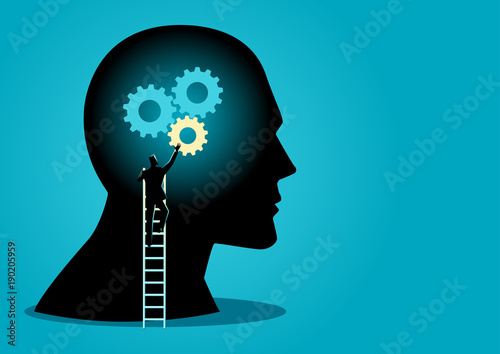 Man on ladder installing gears on human head