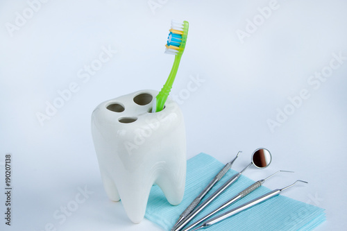Group of tools and accessories for dental care and treatment. Isolated on white background.