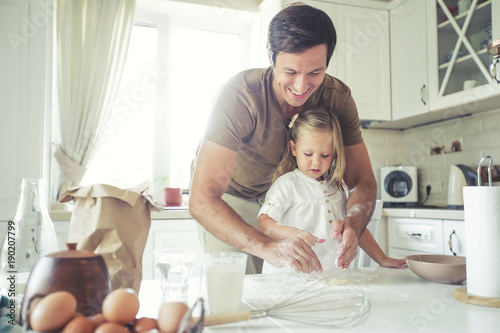 The family cooks in the kitchen 