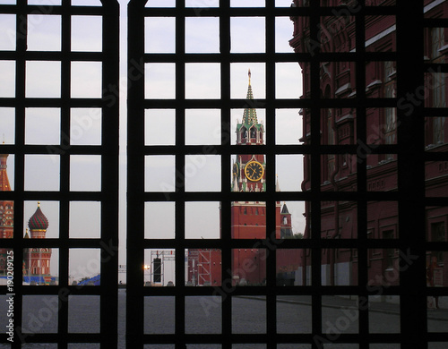 MOSCOW, RUSSIA - September 5, 2008: View of the Kremlin's Rescue Tower on the Red Square through the lattice of the gate of the left entrance of the Sunday Gates