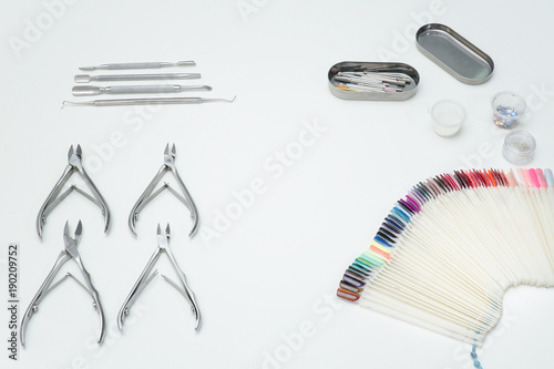Wallpaper Mural Tools аor manicure, tongs, palette. White background. Torontodigital.ca