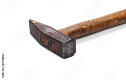 Old rusty metal hammer with wooden handle, isolated on white