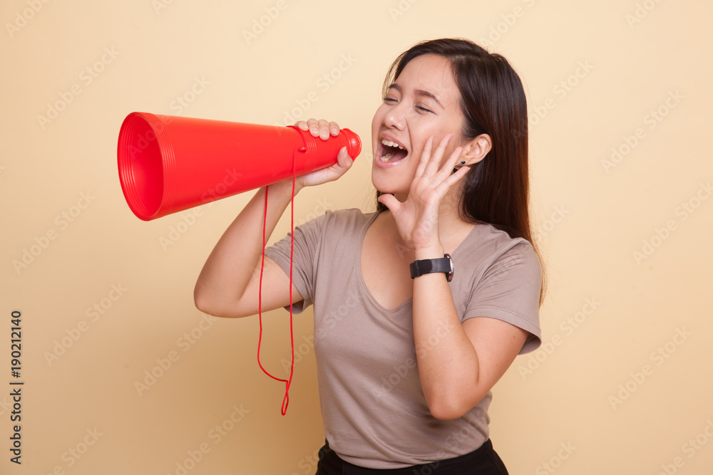 Beautiful young Asian woman announce with megaphone. Beautiful young Asian woman announce with megaphone.