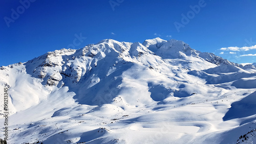 beautiful mountain in snow under blue sky © coco