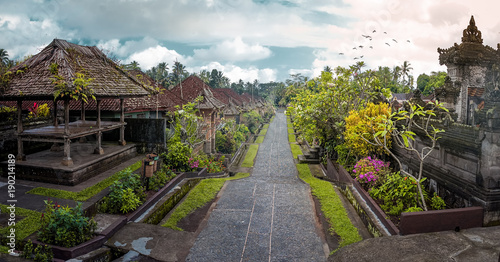 Penglipuran is a traditional balinese village at Bangli Regency with Bale Bengong for meeting (pavilion) and straight street. photo