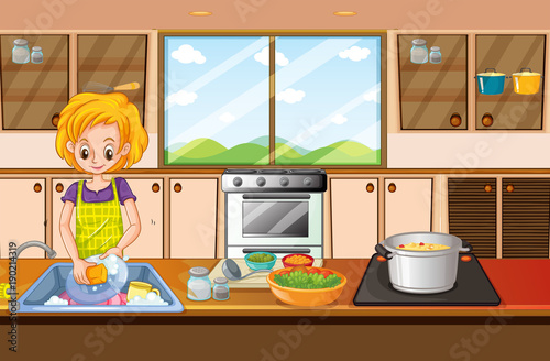 Woman doing dishes in kitchen
