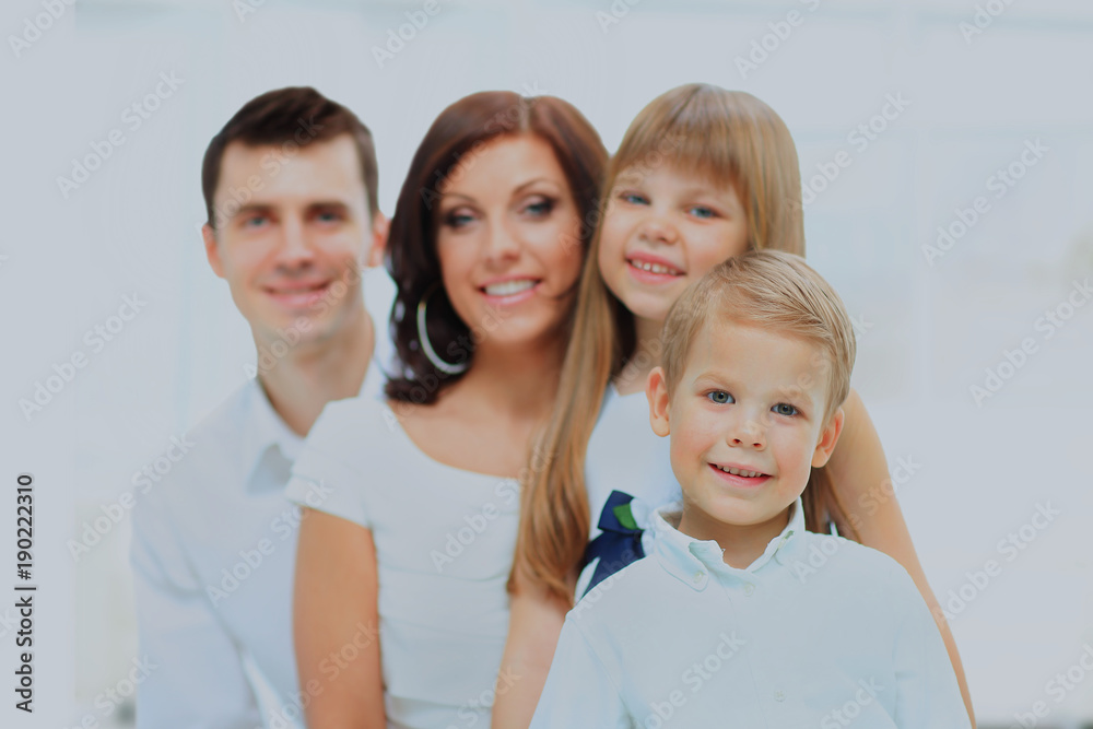 Fototapeta premium Beautiful happy family - isolated over a white background.