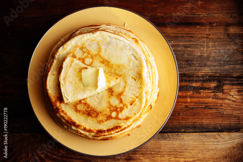 Pancakes with banana, nuts and honey. Traditional Russian cuisine. Maslenitsa. Dessert.