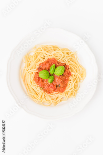 tatsty fresh spaghetti with tomato sauce fresh basil isolated on white background