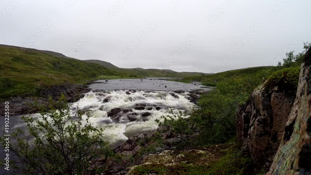 polar river with clean water in the mountains, Kola Peninsula, Russia. polar river with clean water in the mountains, Kola Peninsula, Russia.