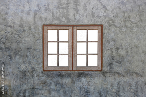 Vintage wooden window on modern concrete wall.