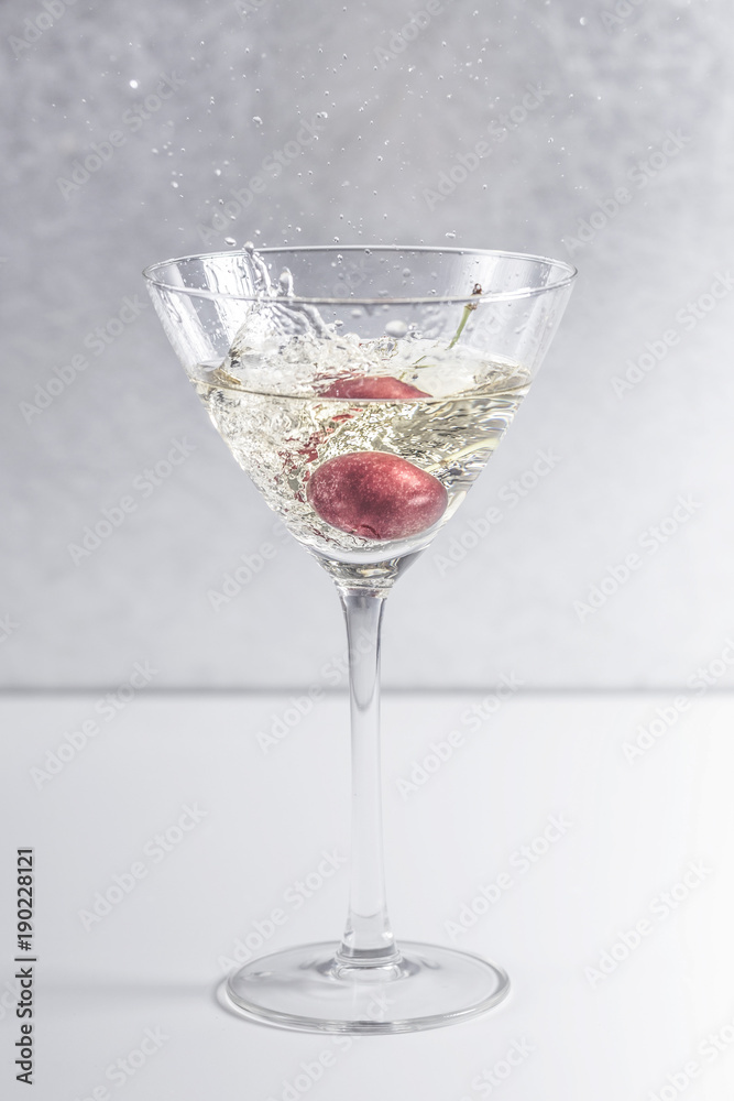 cherry in a cocktail glass cherry in a cocktail glass