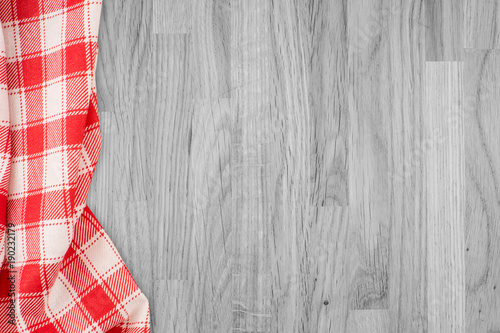 the checkered tablecloth on wooden table