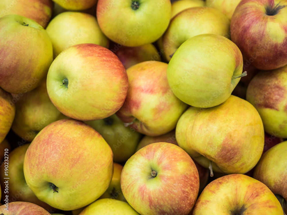 Many apples on the store counter, fruit vitamins