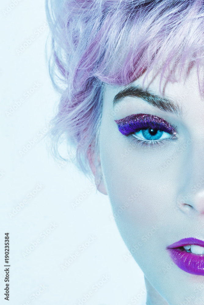 Fototapeta Croped image of beautiful woman face with ultra violet make-up