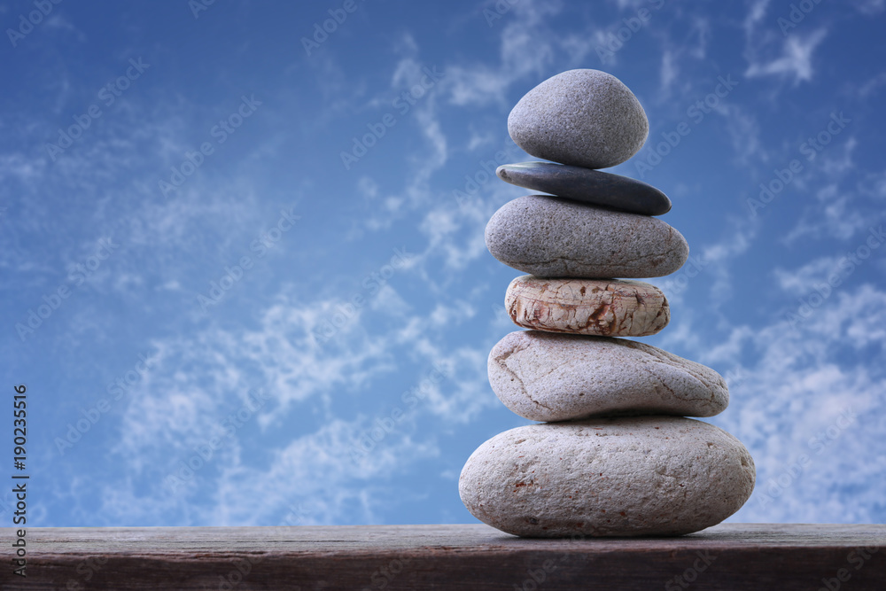 Balance Stones stacked to pyramid in the blue sky background. Balance Stones stacked to pyramid in the blue sky background.