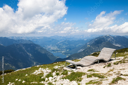 Mountain view with wooden bench on the top. The alpine mountain view, Austria.