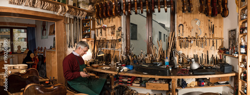 instrument maker working in his workshop