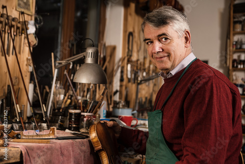 Obraz na plátně instrument maker working in his workshop