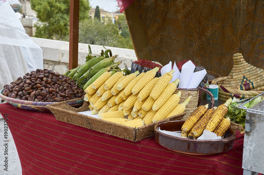 Many corns and chestnuts for sale on a market