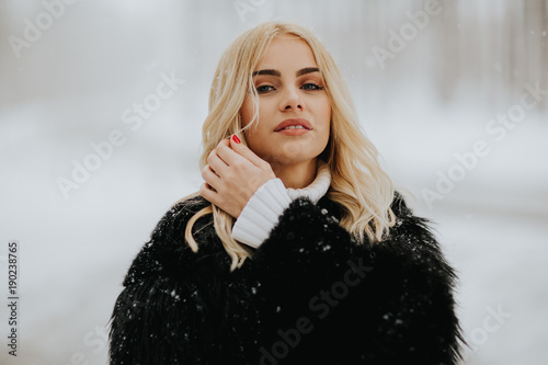 Pretty young blonde woman a...