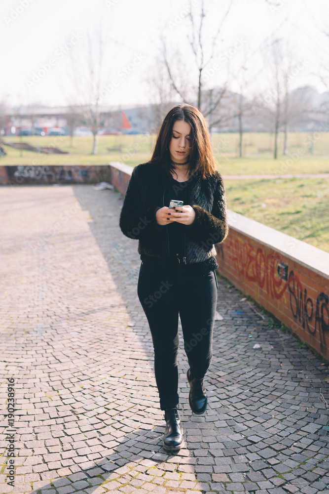 Fototapeta premium young beautiful woman using smartphone