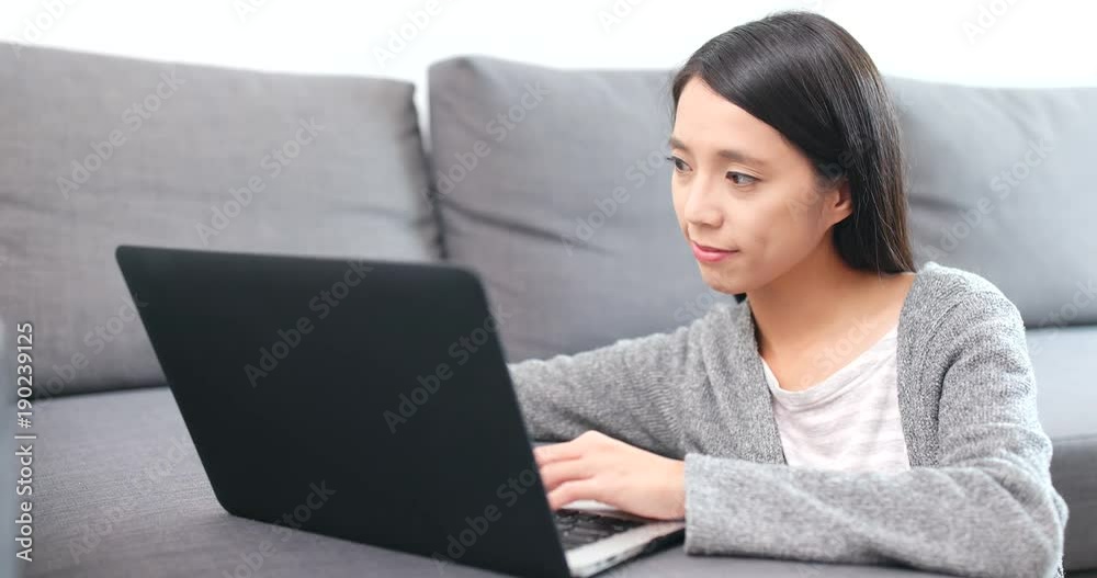 Woman working on laptop computer at home Woman working on laptop computer at home