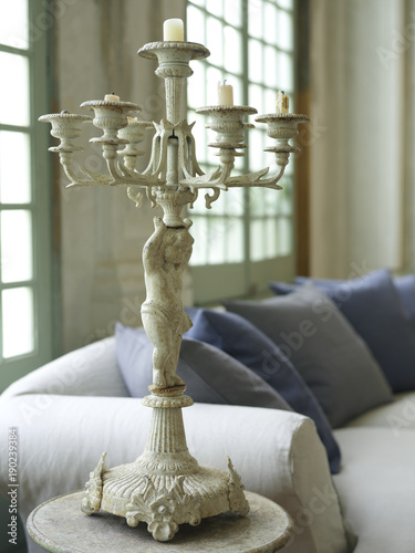 white shabby candle chandelier in a bright living room