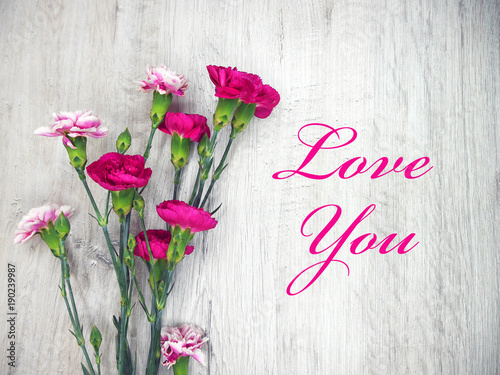 Flowers on a wooden clear background and Love You
