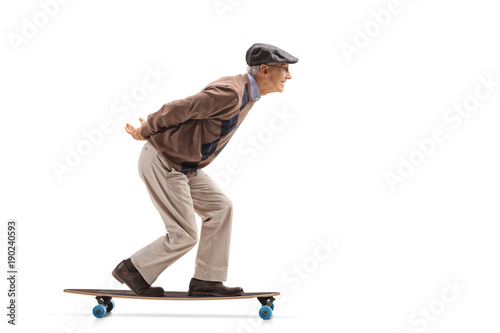 Senior riding a longboard