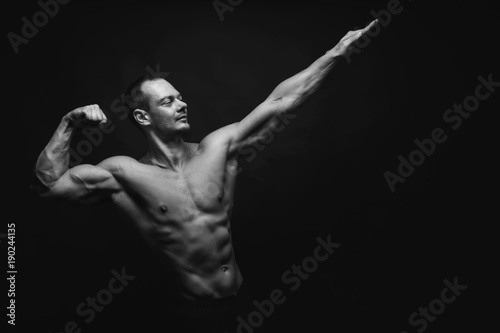 Strong athletic man showes naked muscular body © Prostock-studio