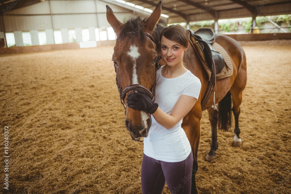 Female rider leading her horse Stock Photo | Adobe Stock