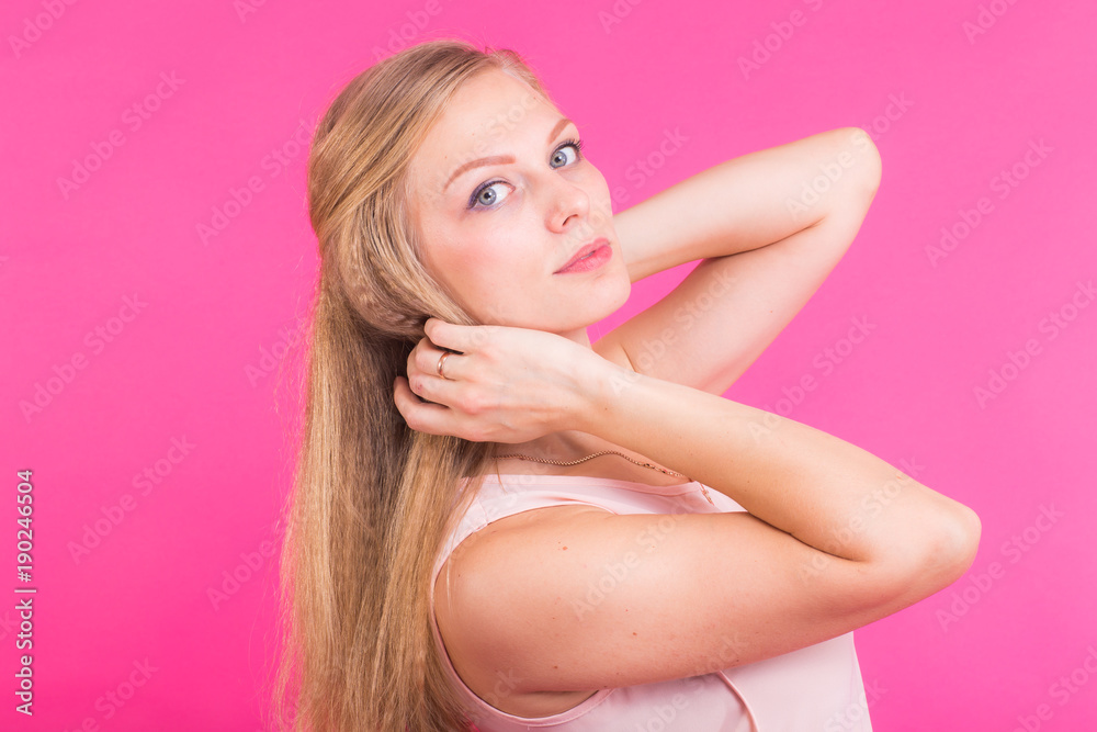 Happy Blonde Woman on pink background. Smiling Fashion Model with Hairstyle Happy Blonde Woman on pink background. Smiling Fashion Model with Hairstyle