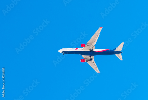 airplane flying against the blue sky