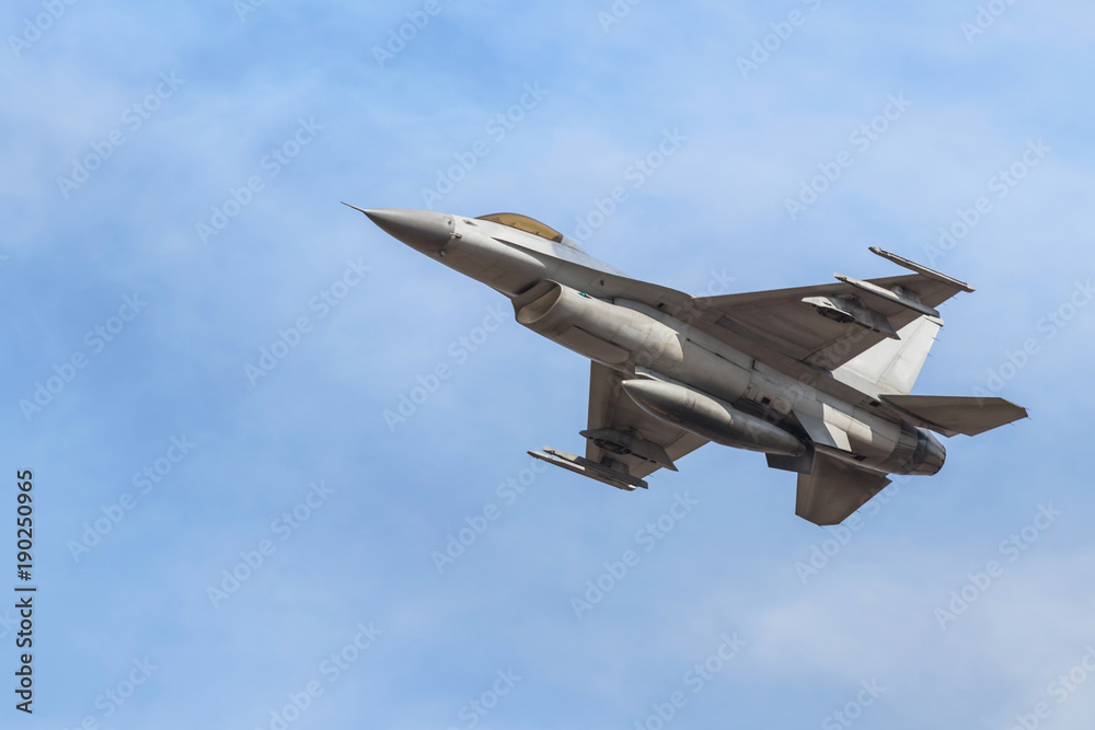 falcon fighter jet military aircraft flying on blue sky background 