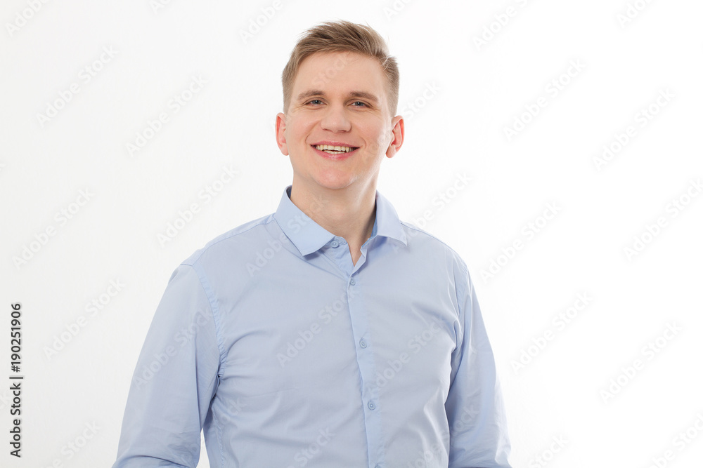 Smiling Handsome young businessman in blank shirt. Man looking at camera isolated on white background. Template, mock up and copy space. Smiling Handsome young businessman in blank shirt. Man looking at camera isolated on white background. Template, mock up and copy space.
