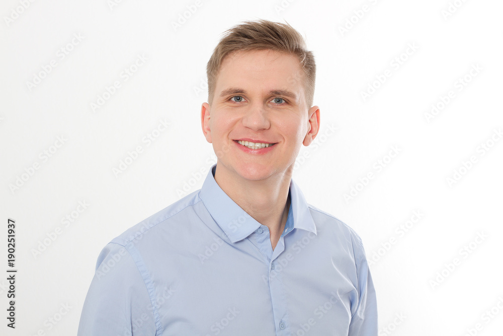 Portrait of happy smiling young businessman in blue template and blank shirt isolated on white background. Business concept. Copy space and mock up. Advertising Portrait of happy smiling young businessman in blue template and blank shirt isolated on white background. Business concept. Copy space and mock up. Advertising