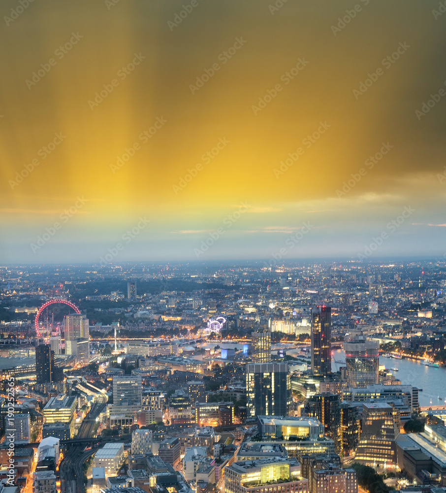 Fototapeta premium City skyline along river Thames at night, aerial view - London - UK