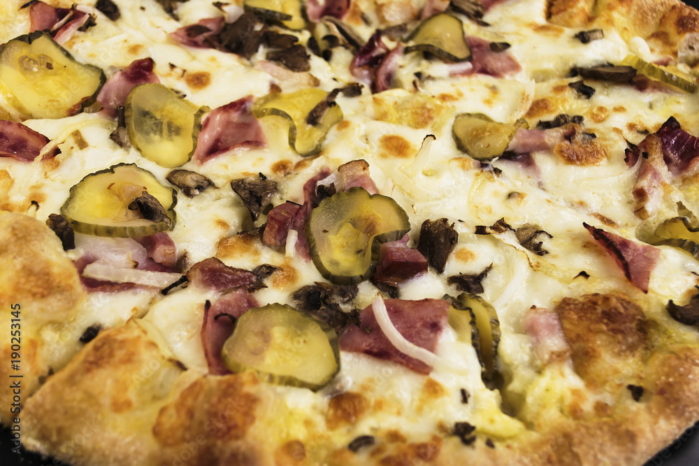 Pizza with pickled cucumber sausage and mushrooms with cheese