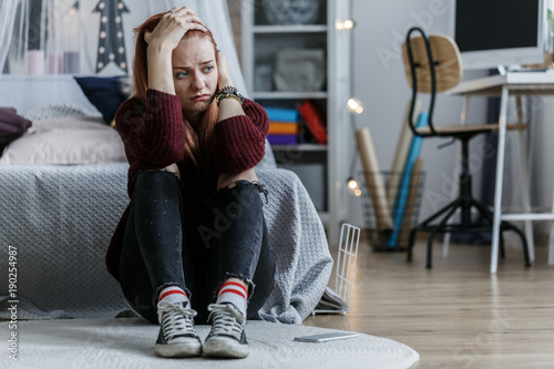 Worried girl holding head