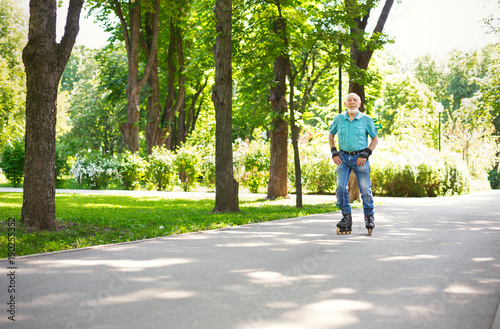 Wallpaper Mural Senior man roller skating outdoors Torontodigital.ca
