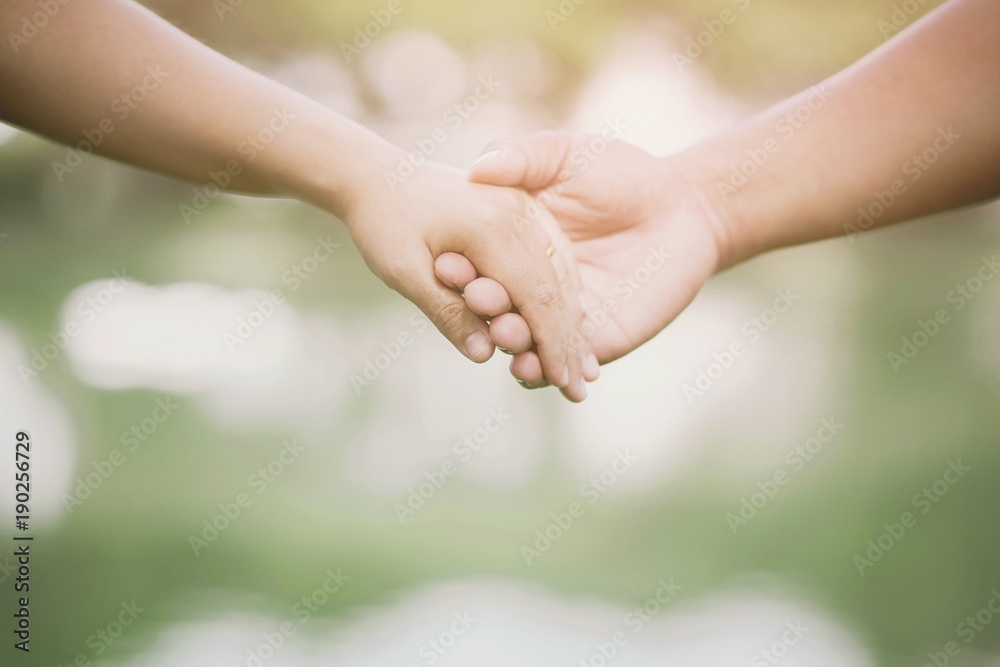 Woman and man holding hands, Happy couple lover in the park. Woman and man holding hands, Happy couple lover in the park.