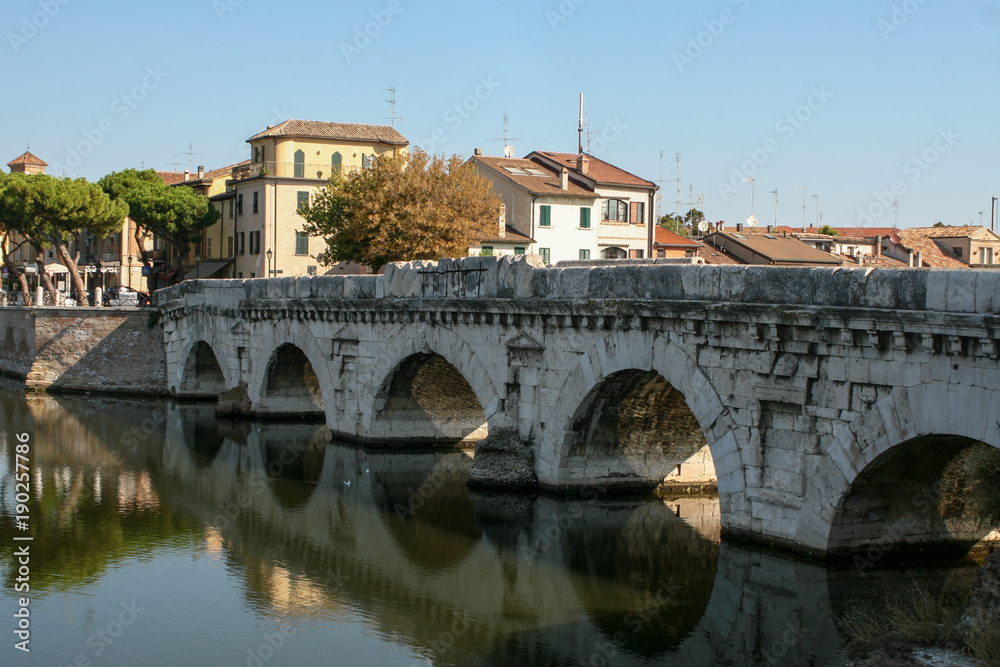 Summer. Italy. Rimini. Bridge of Tiberius. Gulls on the bridge. Colorful