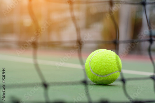 Blur net tennis on ball and court background