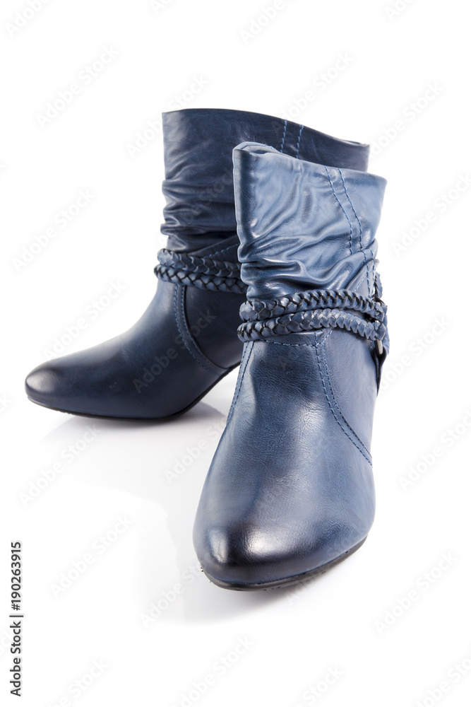 Female blue leather boots on white background, isolated product, comfortable footwear.