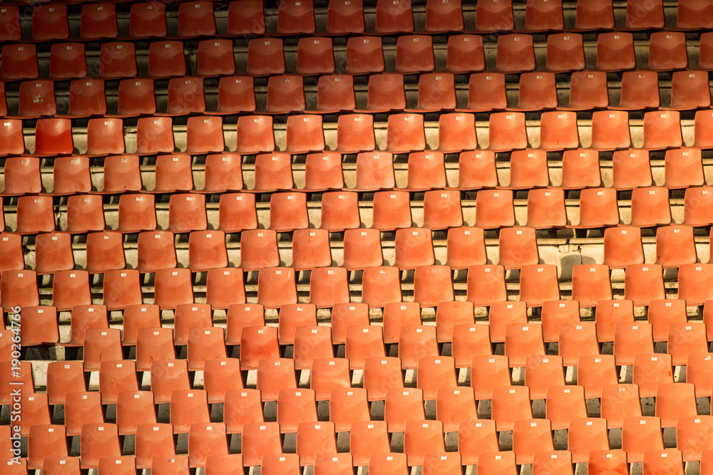Obraz premium Red empty seats at the football stadium
