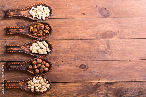 Mix of nuts in wooden spoon