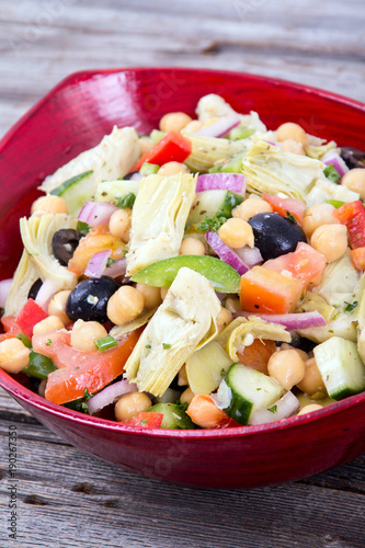 mixed Mediterranean salad bowl with artichoke and chick peas