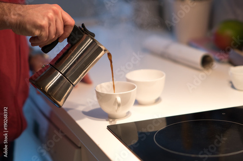 Pouring coffee from a moka pot