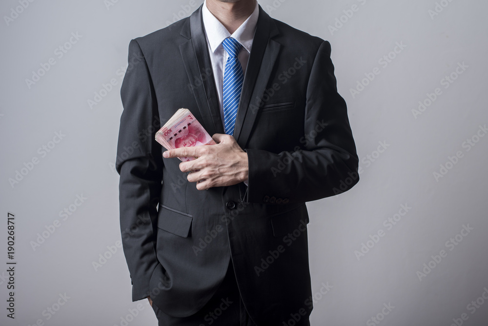 Business man holding China money Business man holding China money